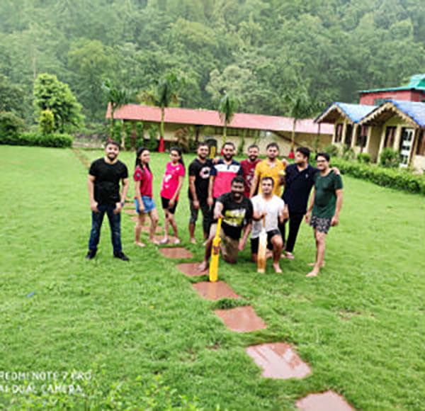Group Picture of WCS India Employees playing Cricket in Rishikesh